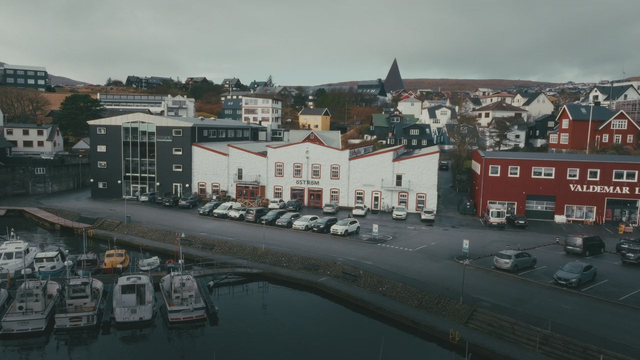Load video: Discover Tórshavn and the Faroe Islands with Østrøm. Explore guided bike tours, outdoor gear, Faroese wool sweaters, and local design inspired by Nordic outdoor living